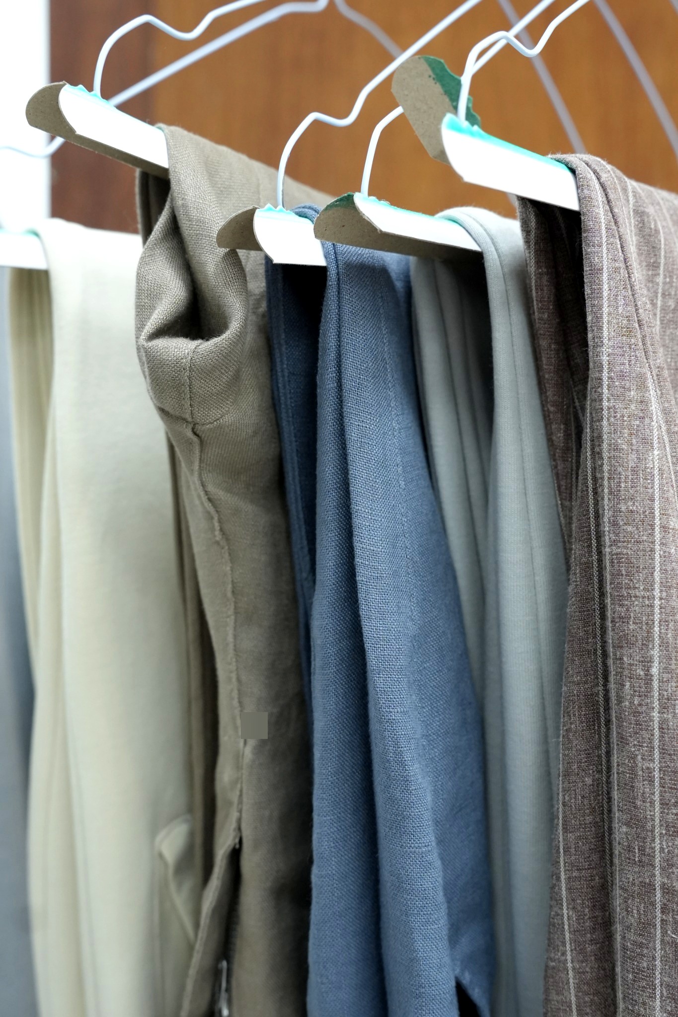 Clean fabrics on hangers at GPT Automatic Laundry Abu Dhabi