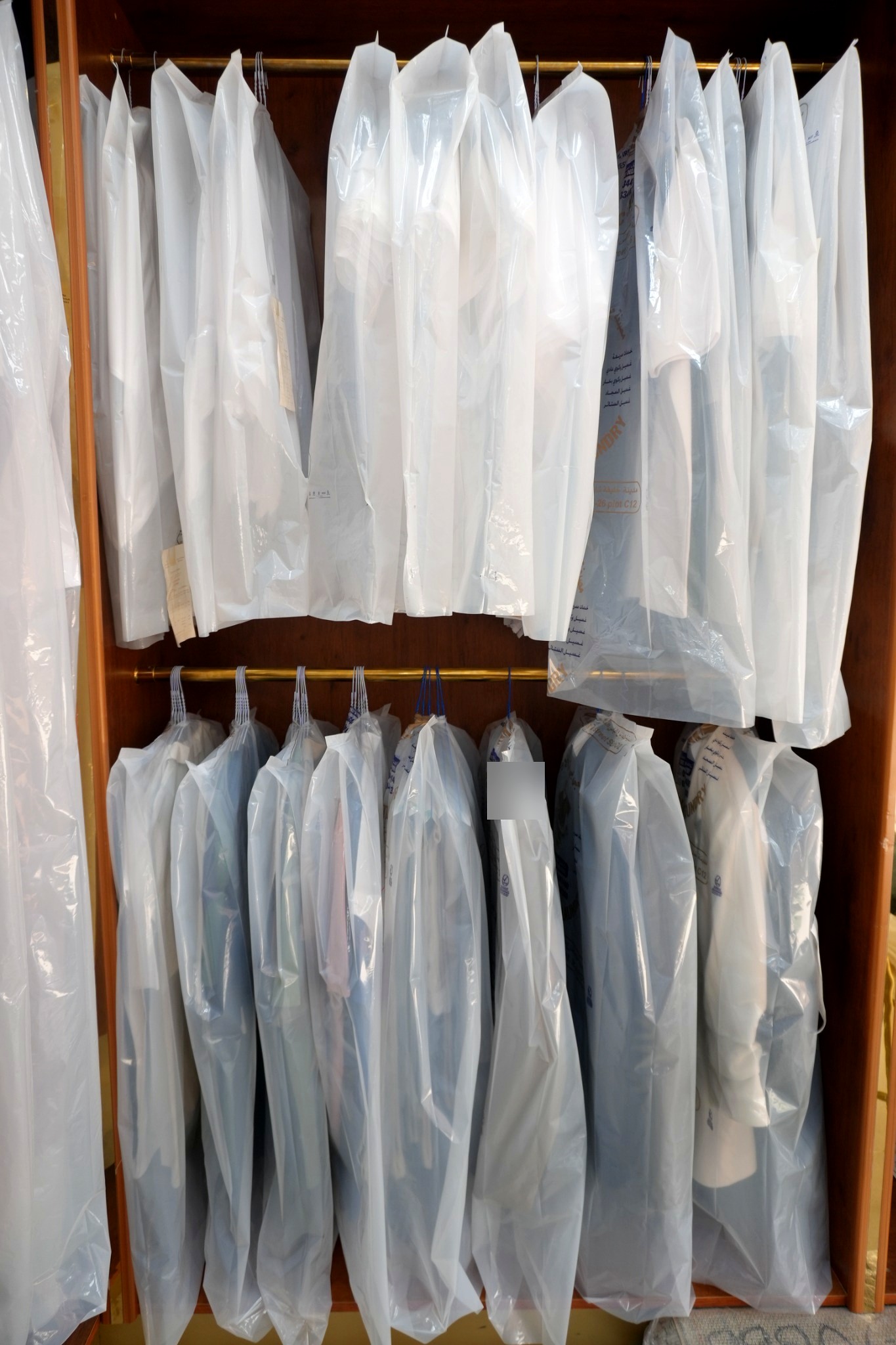 Hanging uniforms at GPT Automatic Laundry Abu Dhabi