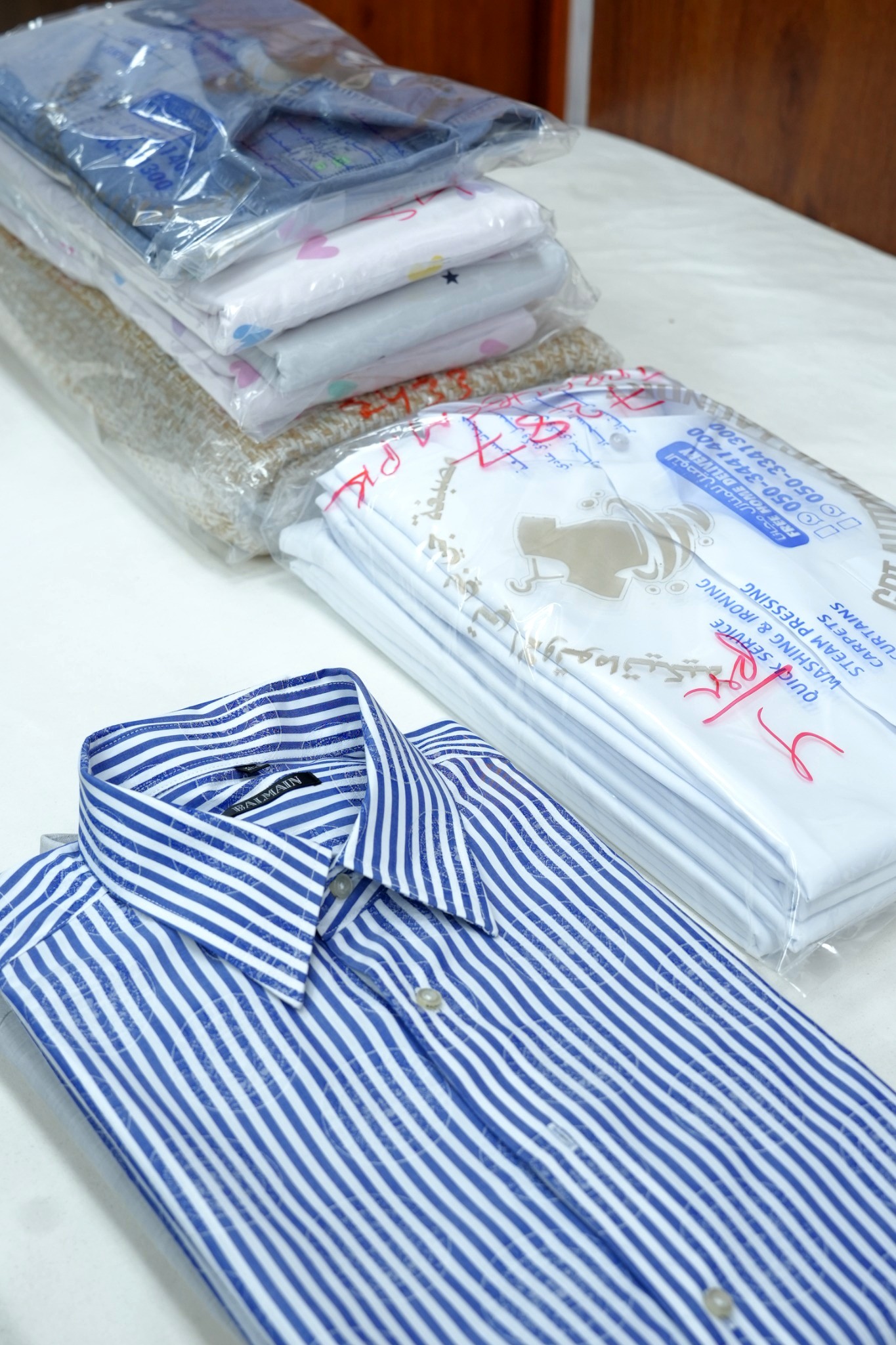 Pressed shirt packaging at GPT Automatic Laundry